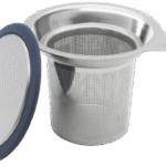 Collection of tea accessories including infusers, spoons, and storage tins on transparent background